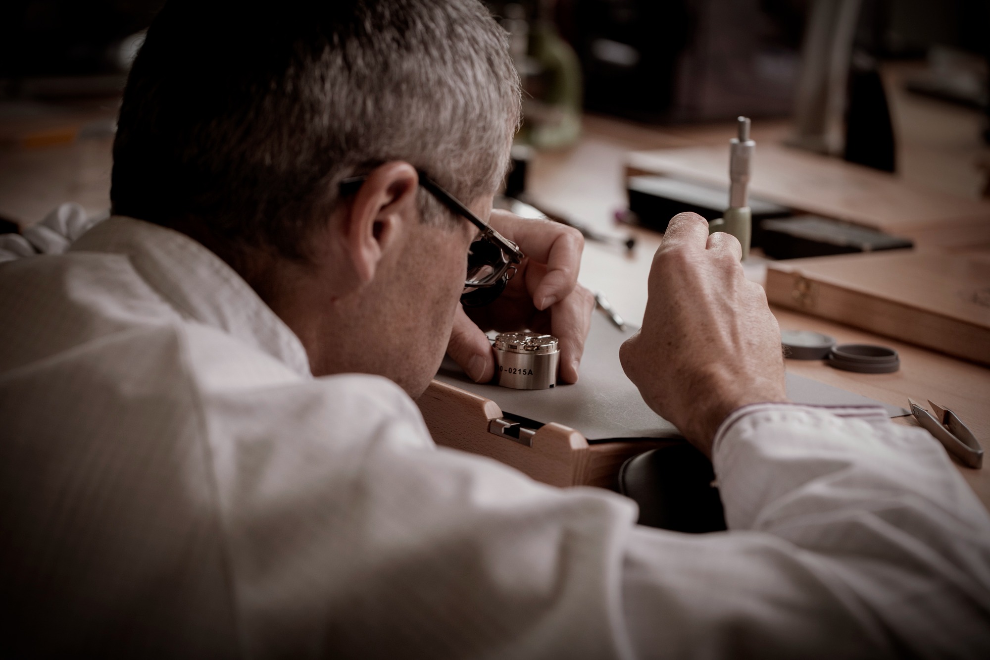 Watchmaker working on a movement